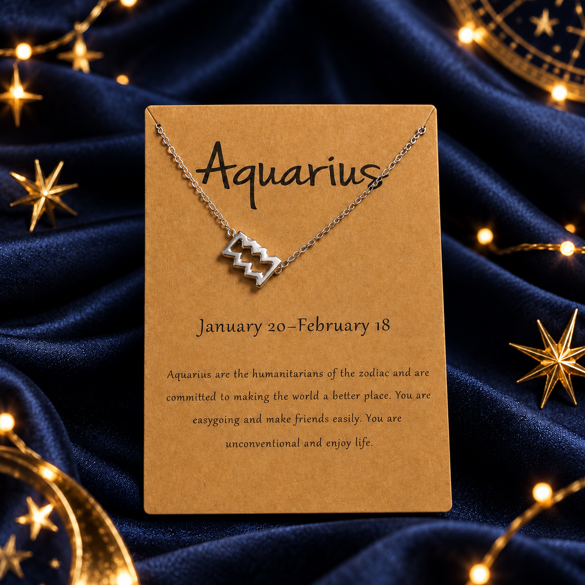 Aquarius zodiac necklace on a star-themed satin background