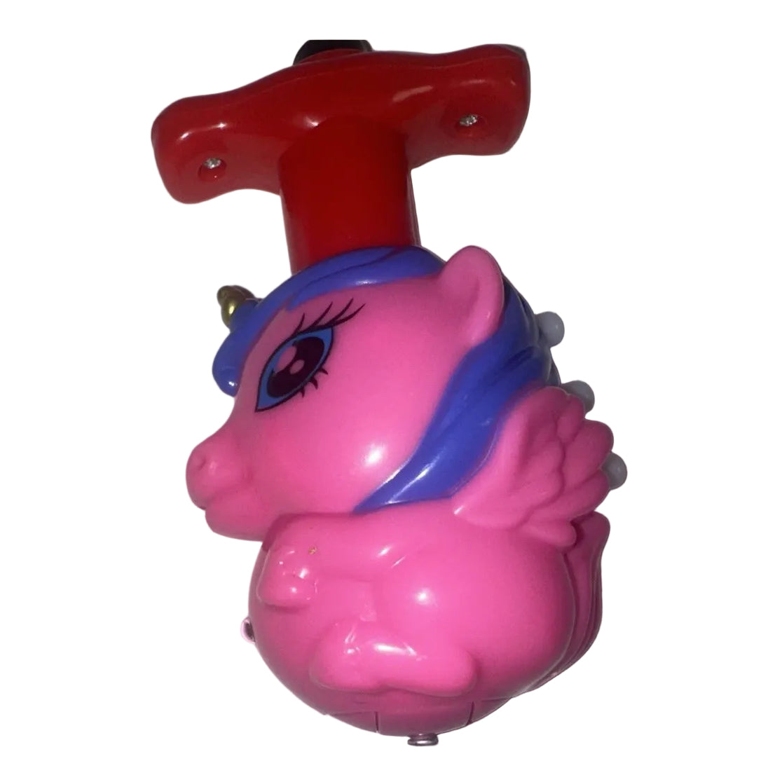 Close-up pink pony spinning top