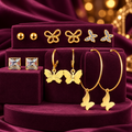 Gold-Tone Butterfly, Ball and Square Stud Earrings – 6-Pair Set on a decorative coloured jewellery display