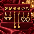 Gold-Tone Butterfly and Heart Fashion Earrings – 6-Pair Set on a decorative coloured display