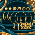 Gold-Tone Heart, Elephant and Butterfly Earrings – 6-Pair Set on a decorative coloured jewellery display