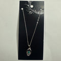 Necklace featuring green accent floral pendant
