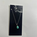 Necklace featuring turquoise teardrop pendant