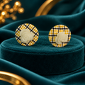 Yellow Black and White Plaid Round Stud Earrings with Cream Rose Detail on teal satin display