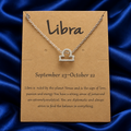 Silver-tone Libra necklace on original printed zodiac card, without plastic