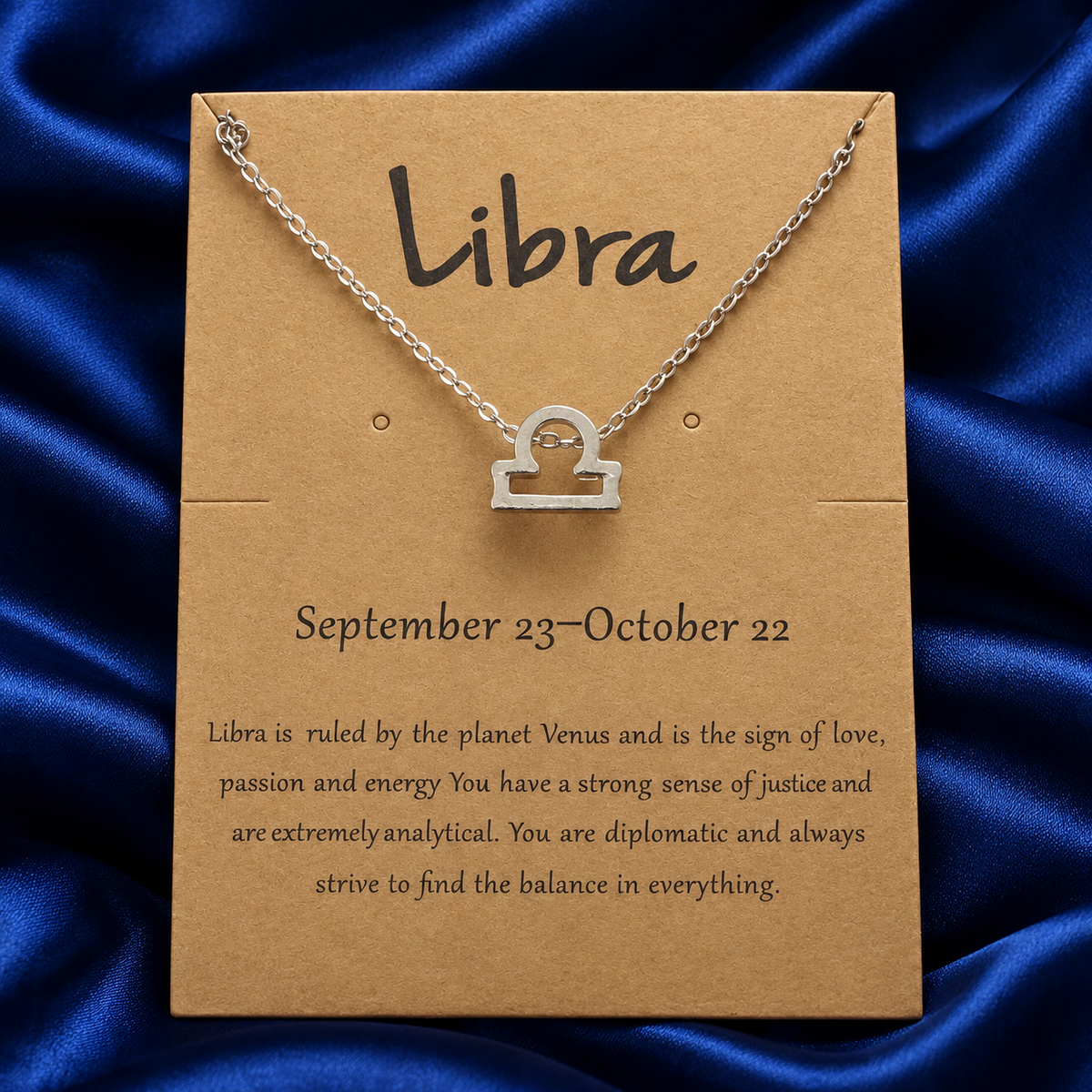 Silver-tone Libra necklace on original printed zodiac card, without plastic