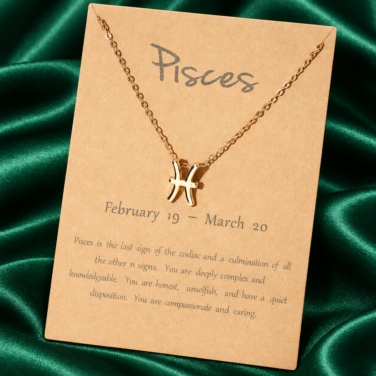 Gold-tone Pisces necklace on original printed zodiac card without plastic